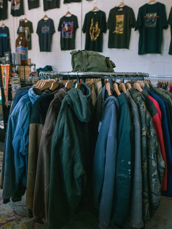 A rack of vintage hoodies and work jackets